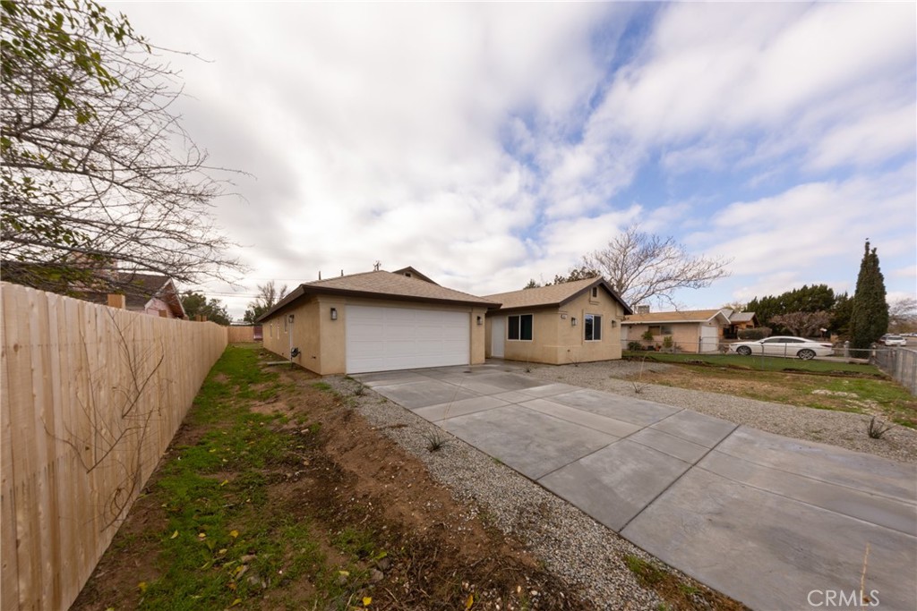 16241 Chestnut Street Hesperia, CA 92345 - Photo 5 of 60 a view of a house with a yard