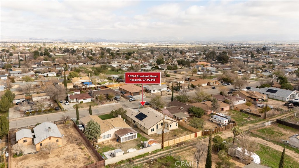 16241 Chestnut Street Hesperia, CA 92345 - Photo 55 of 60 an aerial view of residential building with parking space