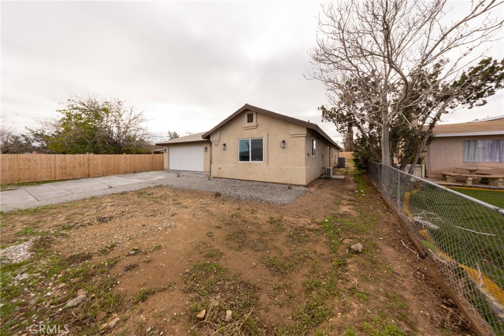 16241 Chestnut Street Hesperia, CA 92345 - Photo 7 of 60 a view of an house with backyard space and garden