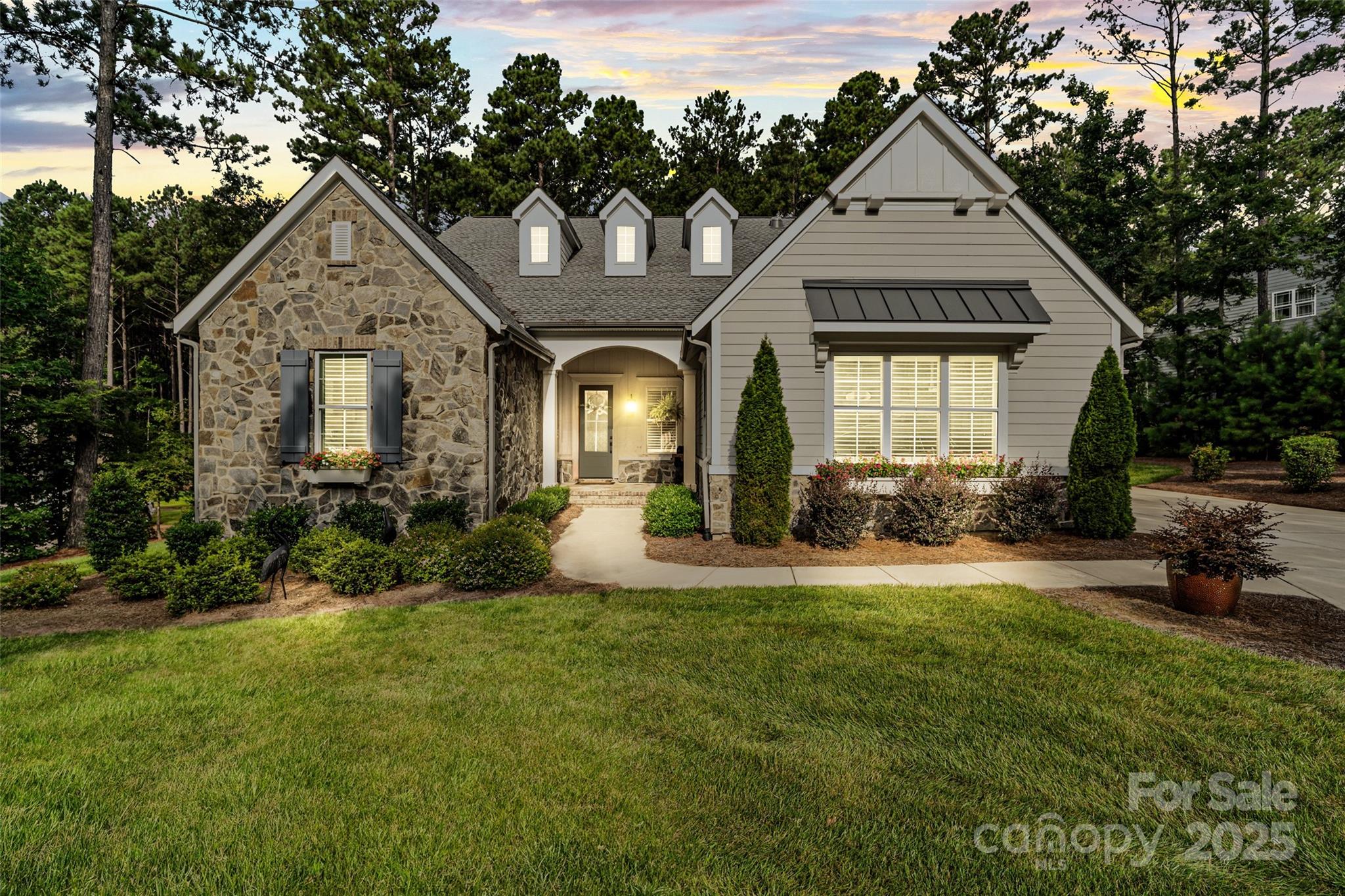 a front view of a house with a yard