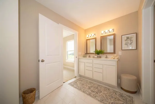 a bathroom with a sink a vanity and a mirror