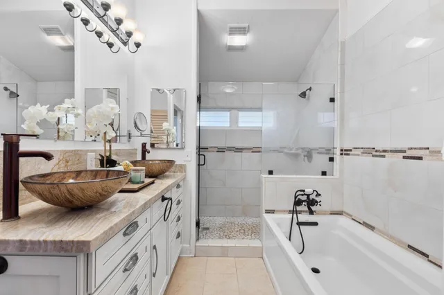 a kitchen with stainless steel appliances granite countertop a sink and a stove