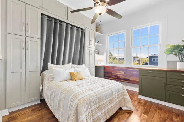 a bedroom with a large bed and a chandelier