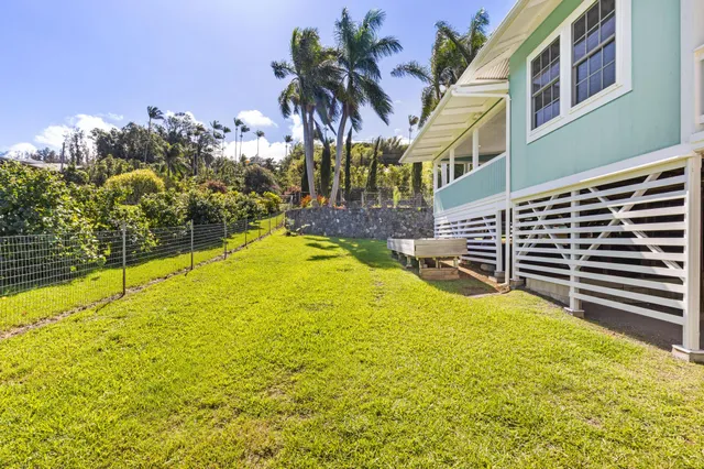 a swimming pool with an outdoor space and seating area