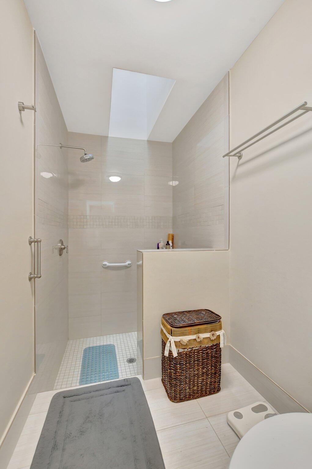 9717 Erica Court Boca Raton, FL 33496 - Photo 15 of 49 a bathroom with a sink a toilet and shower