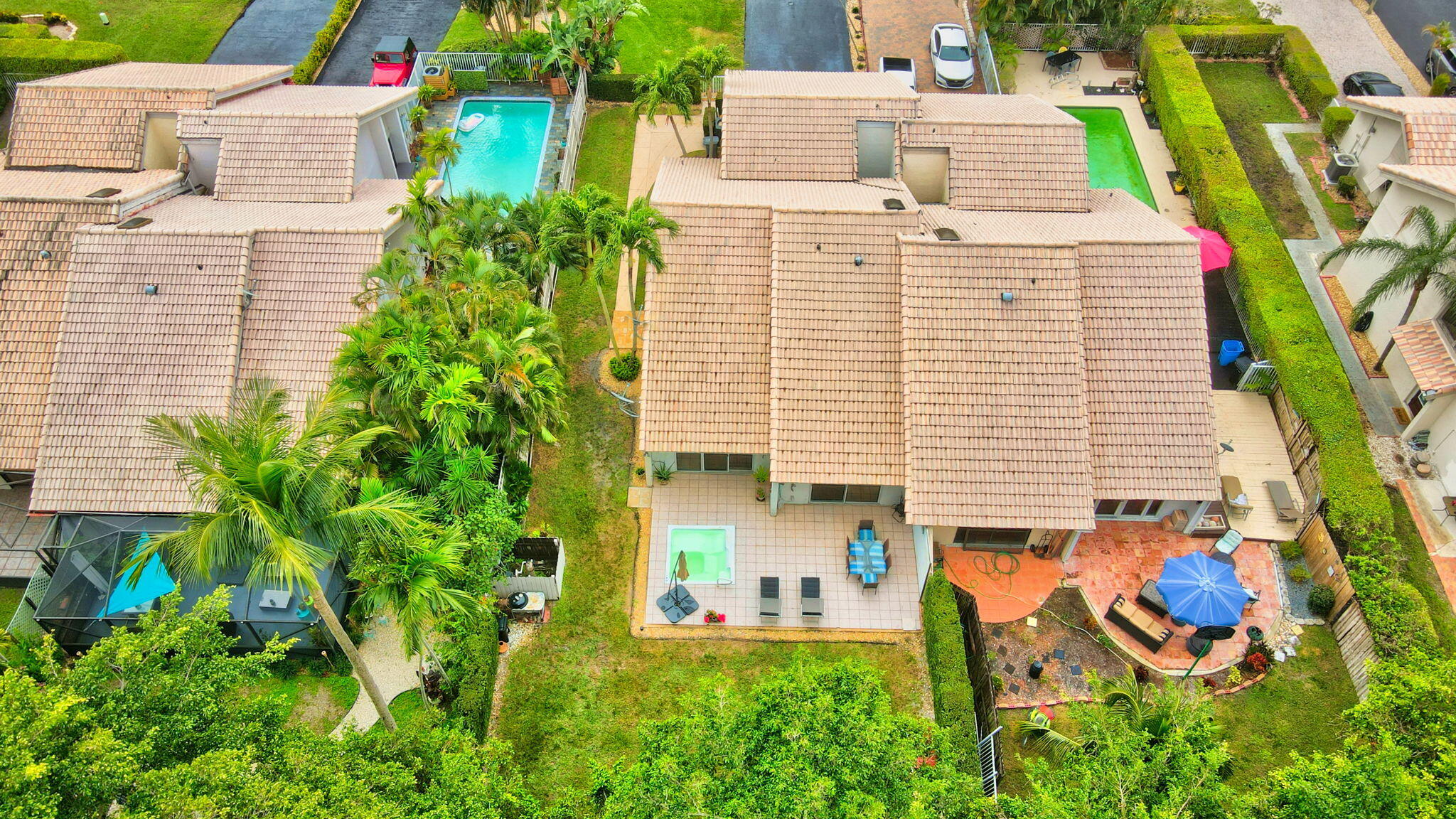 9717 Erica Court Boca Raton, FL 33496 - Photo 2 of 49 an aerial view of a house with pool and garden