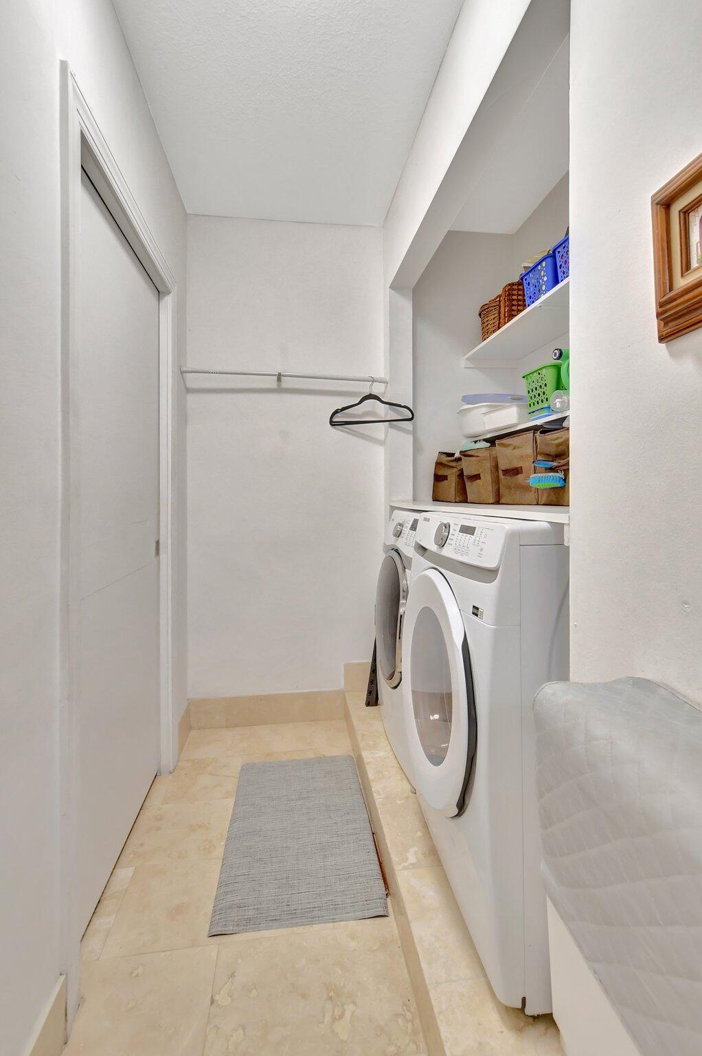 9717 Erica Court Boca Raton, FL 33496 - Photo 27 of 49 a utility room with dryer and washer