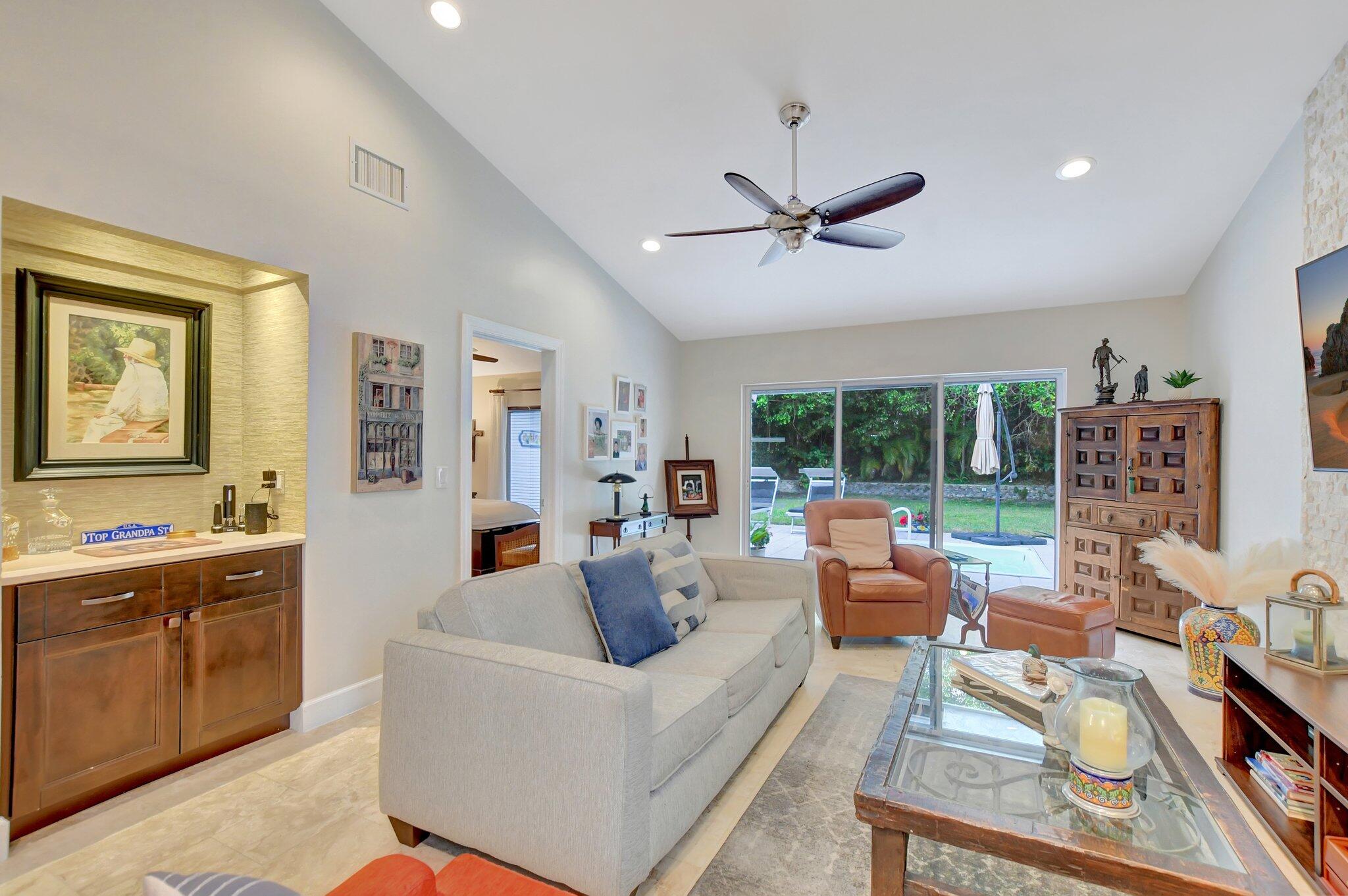 9717 Erica Court Boca Raton, FL 33496 - Photo 34 of 49 a living room with furniture and a large window