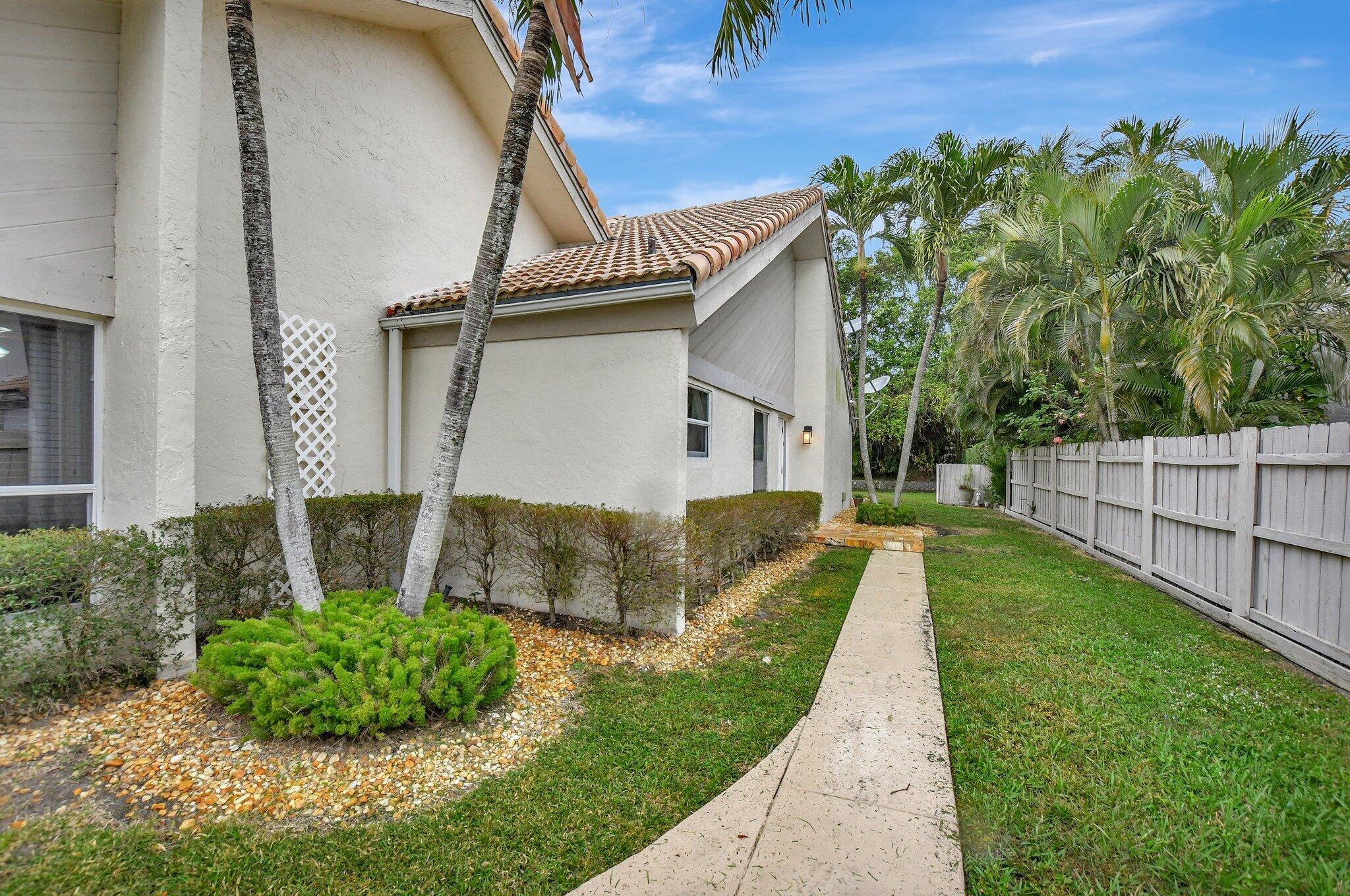 9717 Erica Court Boca Raton, FL 33496 - Photo 40 of 49 a view of a house with a yard