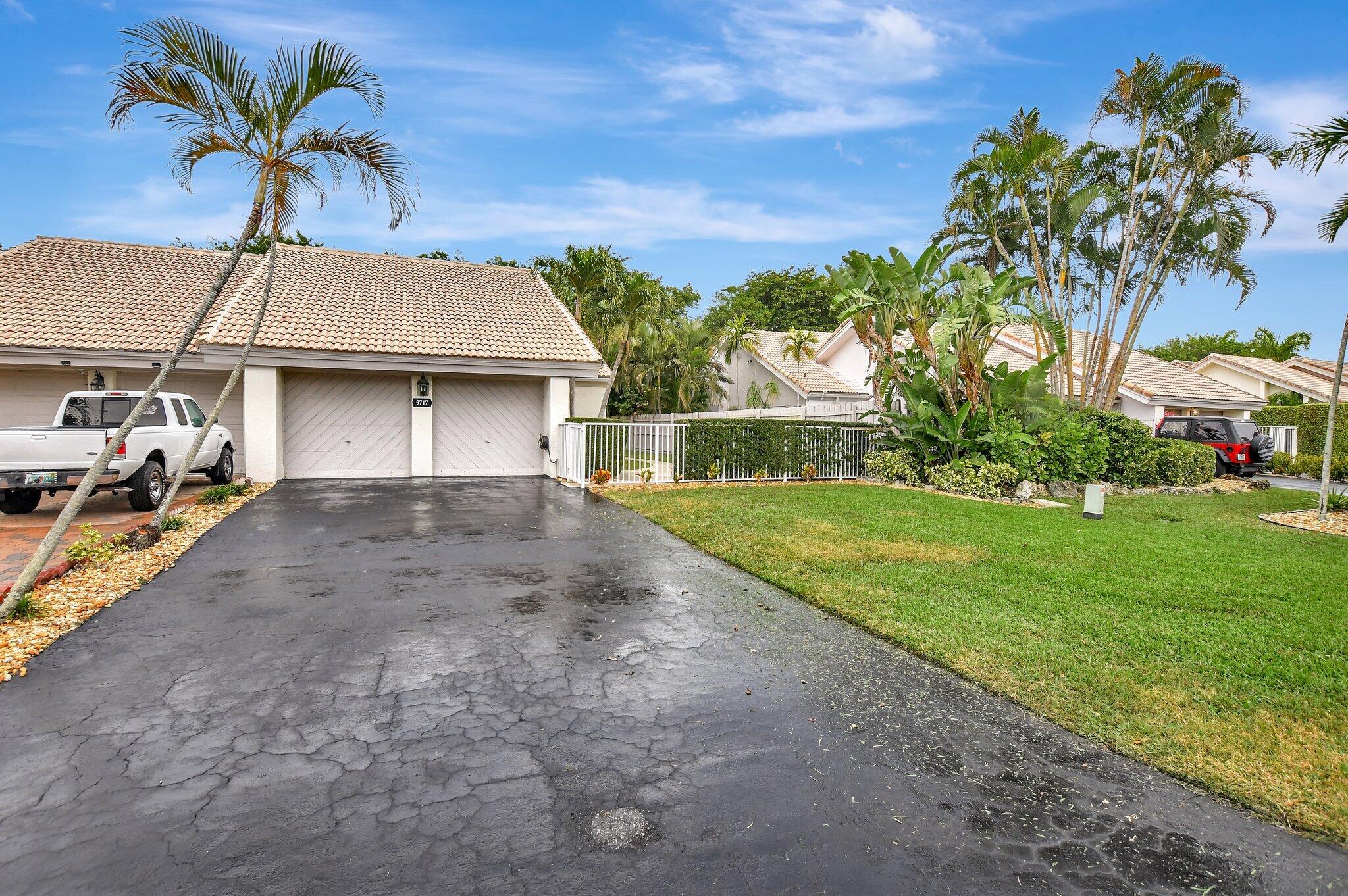 9717 Erica Court Boca Raton, FL 33496 - Photo 41 of 49 a house view with a garden space