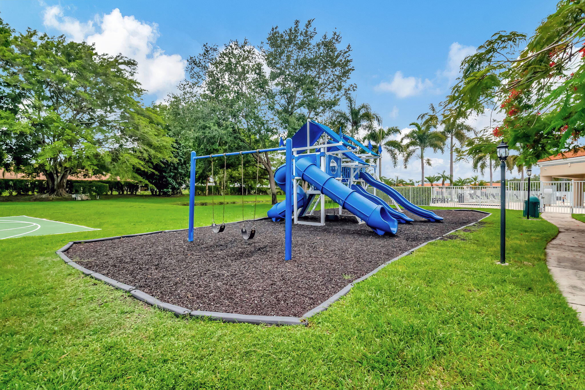 9717 Erica Court Boca Raton, FL 33496 - Photo 46 of 49 a view of a park with swings
