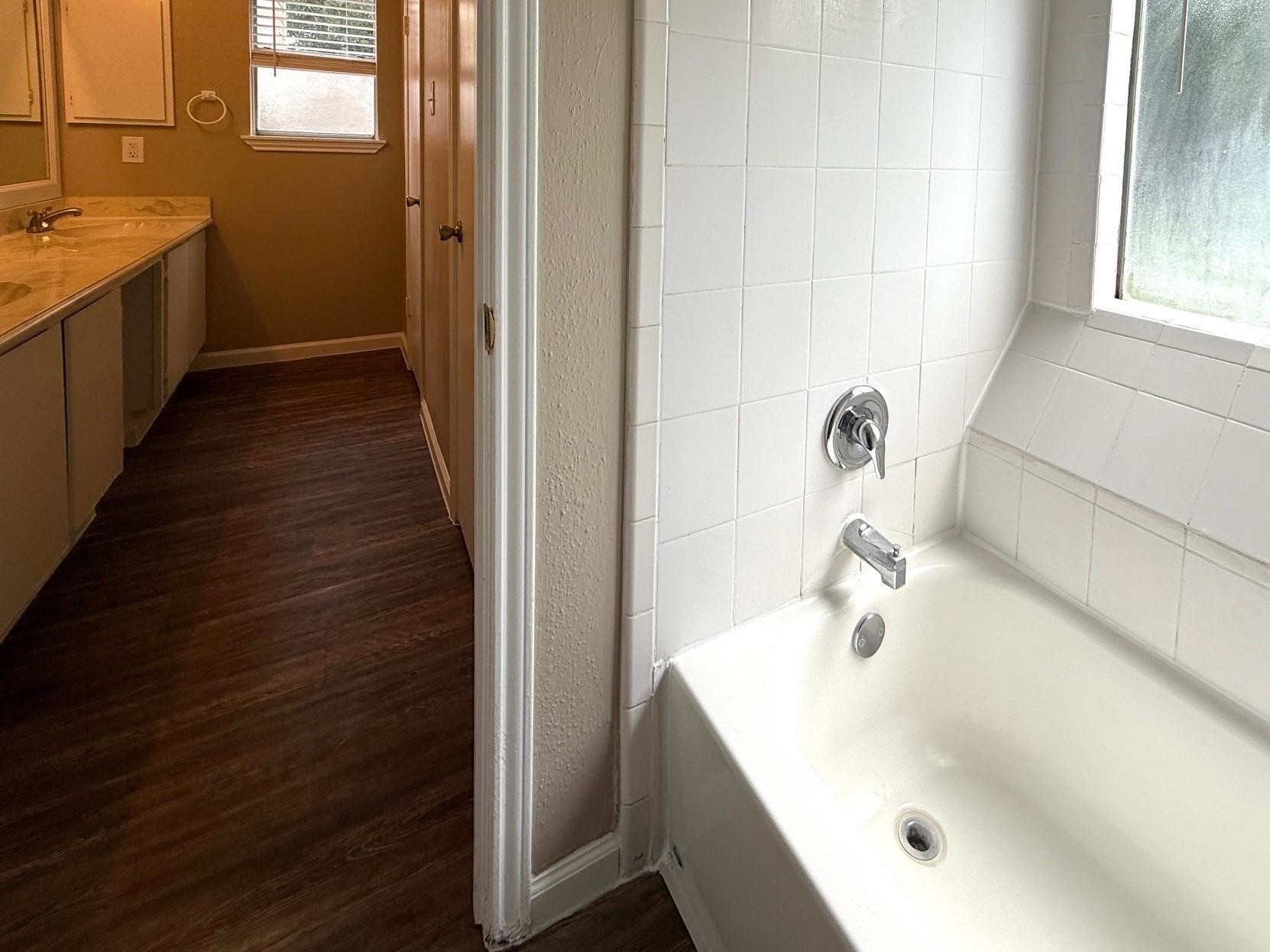 2435 Summer Spring Drive Spring, TX 77373 - Photo 12 of 16 a bathroom with a sink and a tub