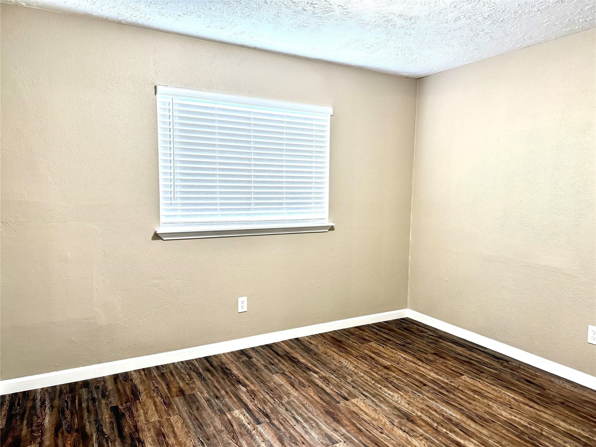 2435 Summer Spring Drive Spring, TX 77373 - Photo 15 of 16 a view of a room with wooden floor and a window