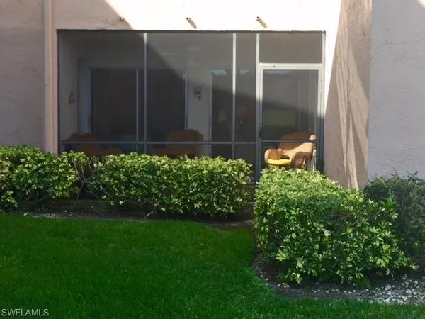 a view of a backyard with potted plants