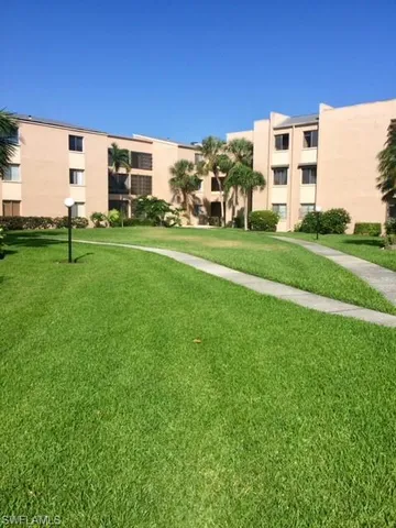 a view of a building with a yard