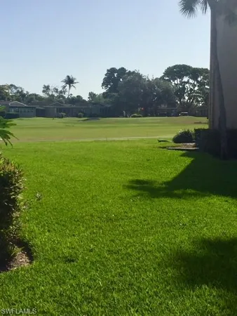 a view of a field with an ocean