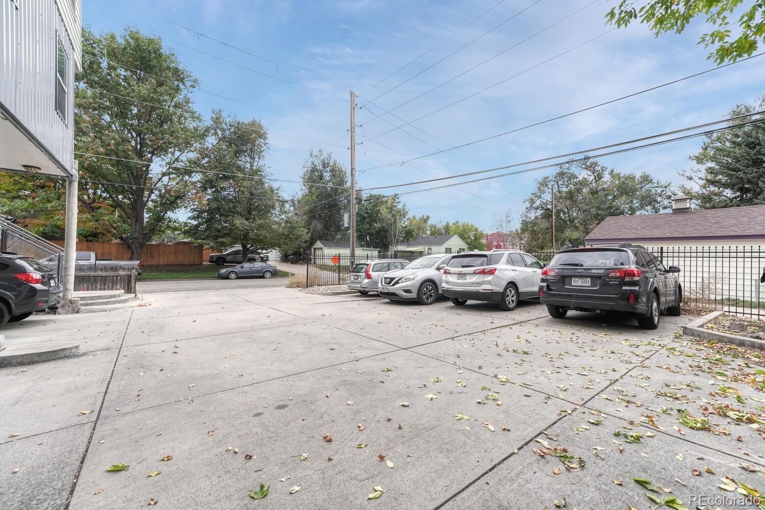 2389 South High Street, Unit 4 Denver, CO 80210 - Photo 25 of 27 a view of cars parked on the side of a street