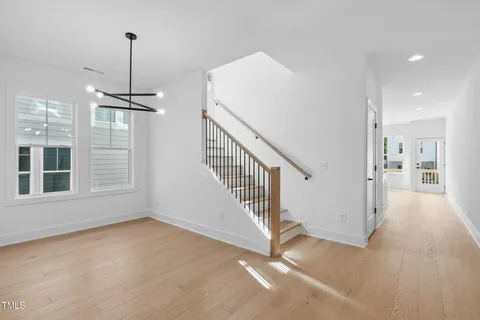a view of a room with stairs and windows