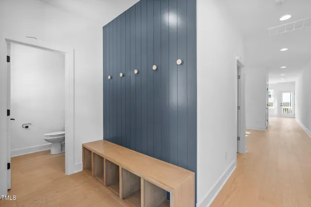 a view of a hallway with bathroom