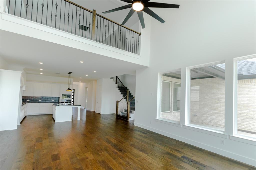 3020 Sunfish Street Prosper, TX 75078 - Photo 15 of 34 a view of entryway and hall with wooden floor