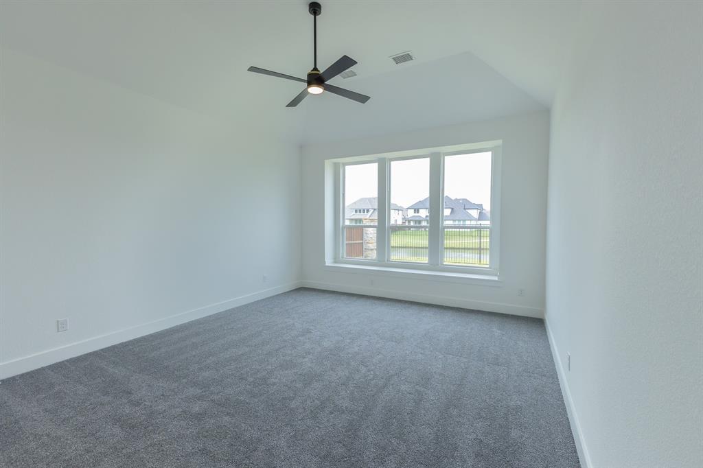 3020 Sunfish Street Prosper, TX 75078 - Photo 17 of 34 a view of an empty room with a window
