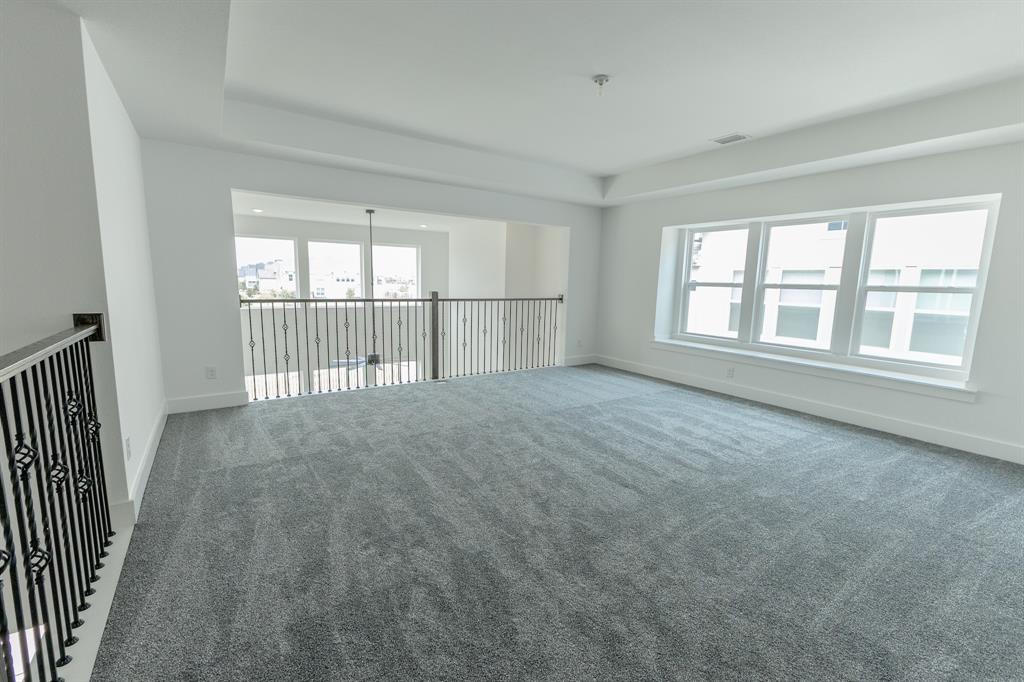 3020 Sunfish Street Prosper, TX 75078 - Photo 20 of 34 wooden floor in an empty room with a window