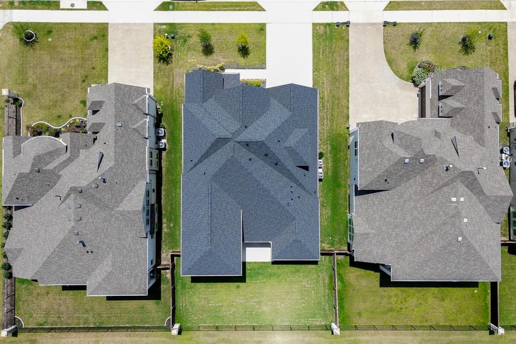 3020 Sunfish Street Prosper, TX 75078 - Photo 34 of 34 an aerial view of a house with a yard