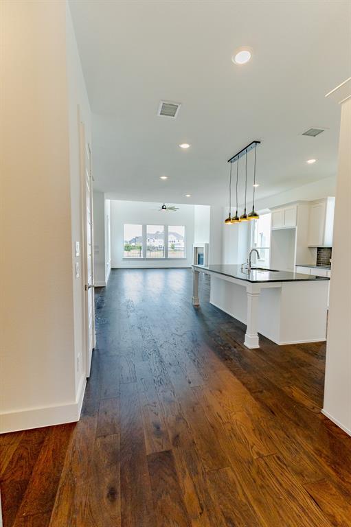 3020 Sunfish Street Prosper, TX 75078 - Photo 8 of 34 a view of kitchen with wooden floor