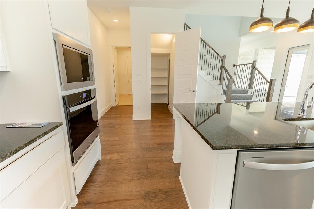 3020 Sunfish Street Prosper, TX 75078 - Photo 10 of 34 a kitchen with stainless steel appliances granite countertop a sink and a stove