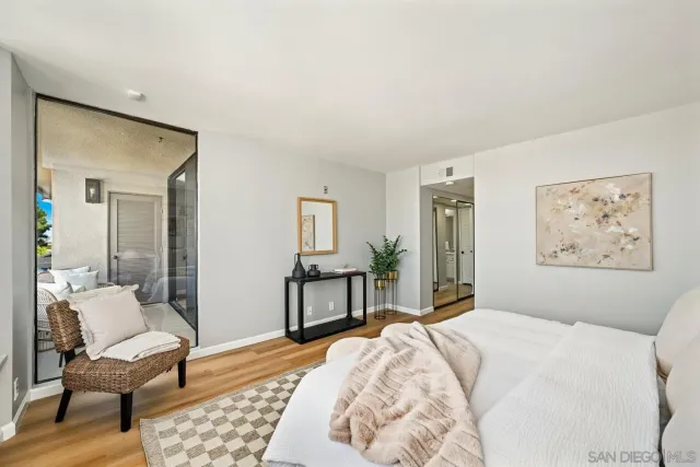 a bedroom with a bed and a desk