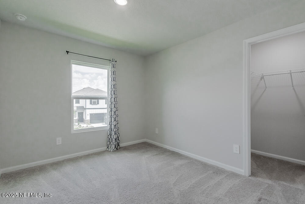 14438 Macadamia Lane Jacksonville, FL 32218 - Photo 20 of 32 an empty room with windows