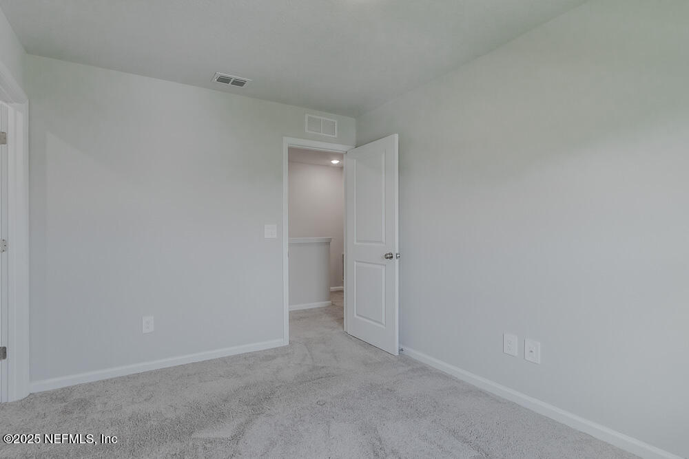 14438 Macadamia Lane Jacksonville, FL 32218 - Photo 21 of 32 a view of an empty room