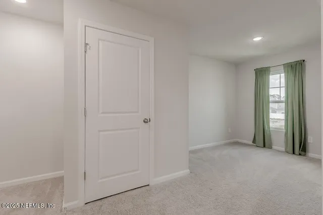 a view of an empty room and window