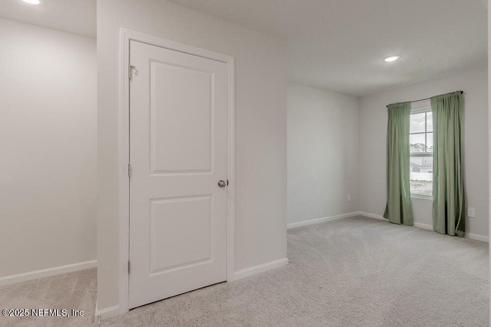 14438 Macadamia Lane Jacksonville, FL 32218 - Photo 22 of 32 a view of an empty room and window