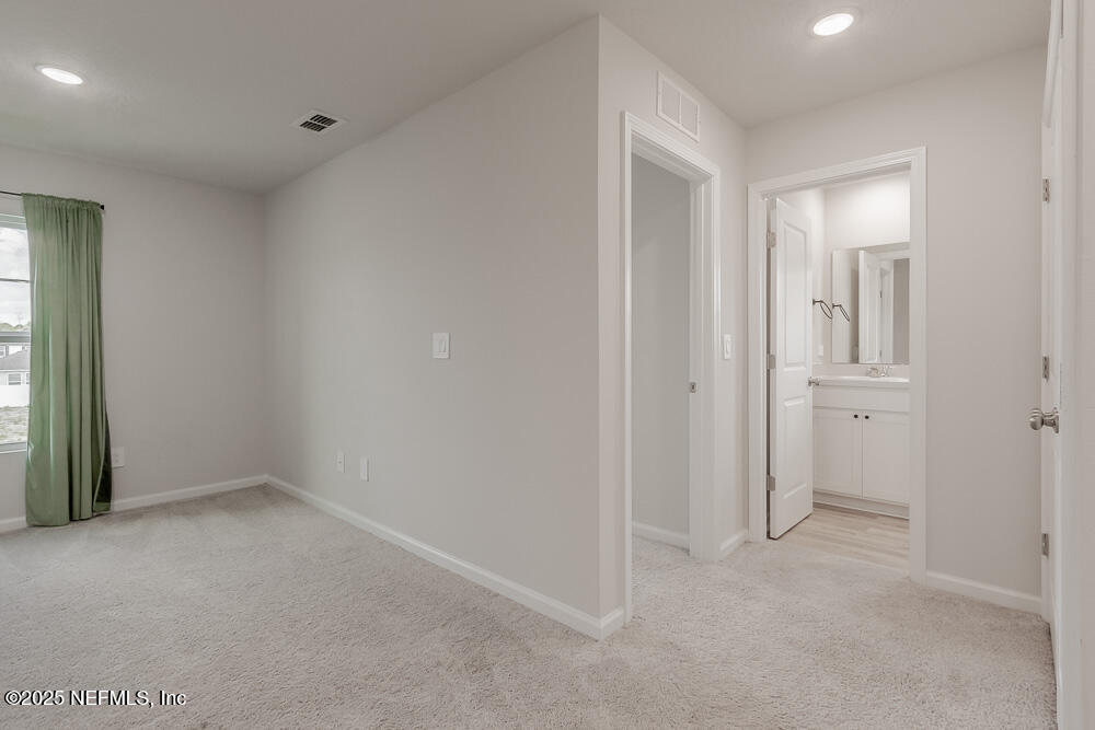 14438 Macadamia Lane Jacksonville, FL 32218 - Photo 24 of 32 wooden floor and windows in a room