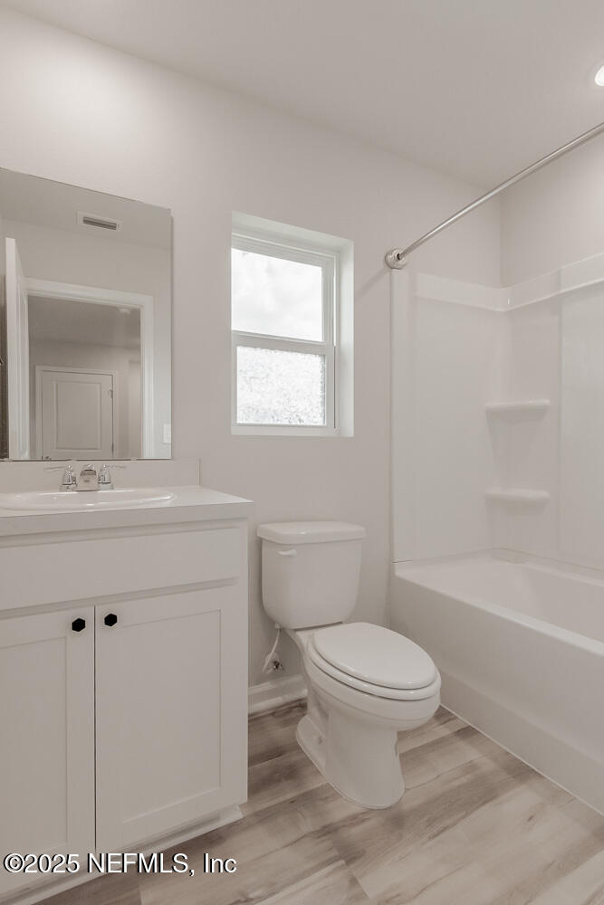 14438 Macadamia Lane Jacksonville, FL 32218 - Photo 25 of 32 a bathroom with a sink a toilet and shower