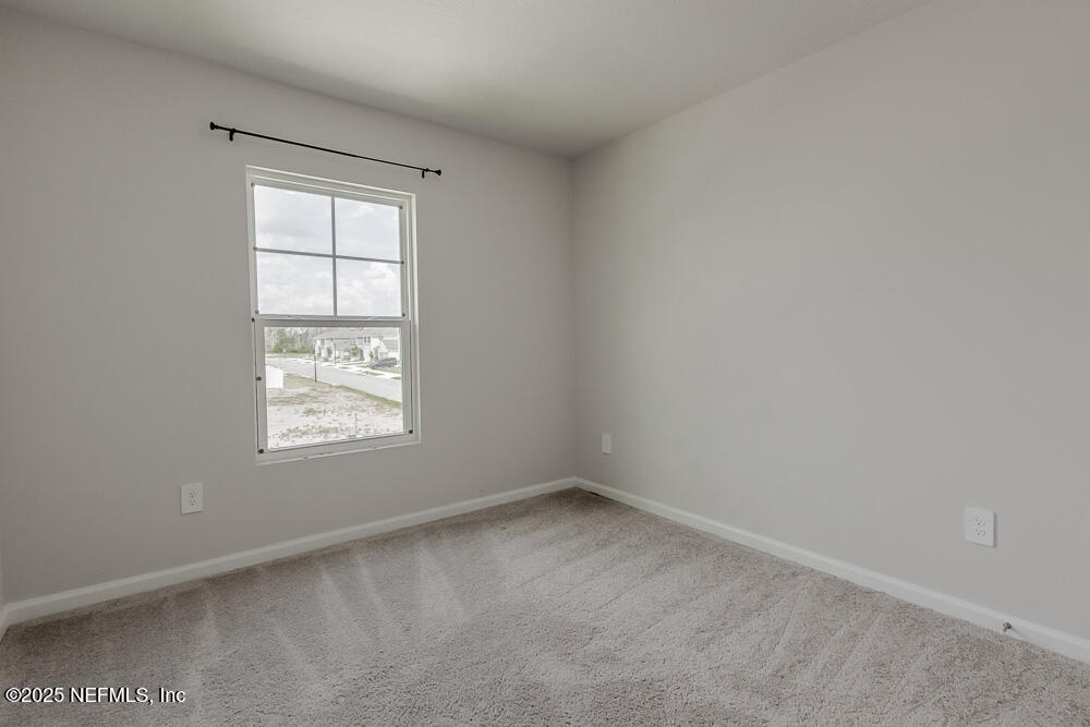 14438 Macadamia Lane Jacksonville, FL 32218 - Photo 26 of 32 an empty room with a window
