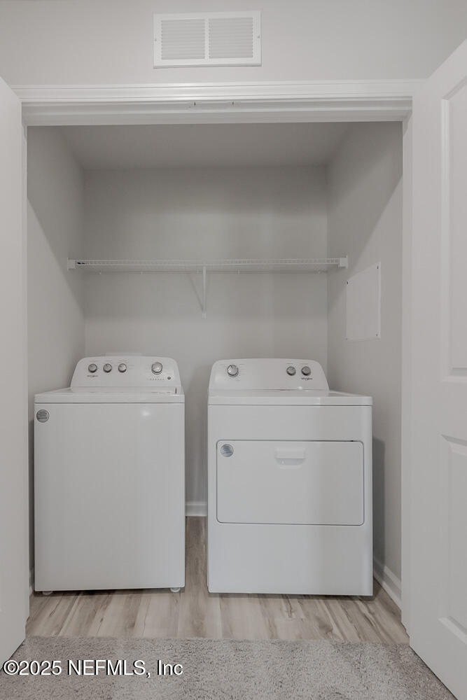 14438 Macadamia Lane Jacksonville, FL 32218 - Photo 28 of 32 a utility room with dryer and washer