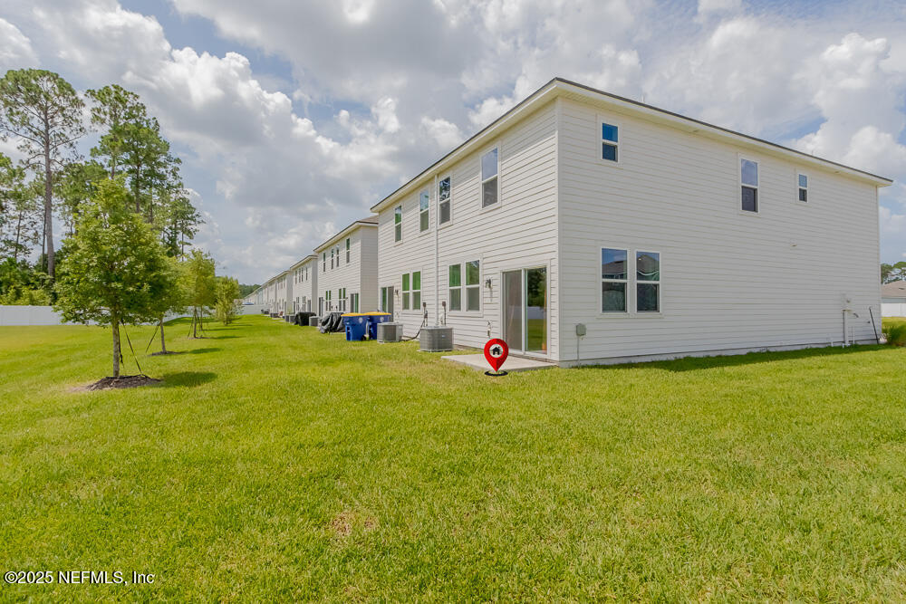 14438 Macadamia Lane Jacksonville, FL 32218 - Photo 30 of 32 a view of a house with backyard
