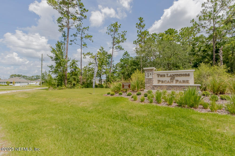 14438 Macadamia Lane Jacksonville, FL 32218 - Photo 32 of 32 a view of a big yard with plants and large trees
