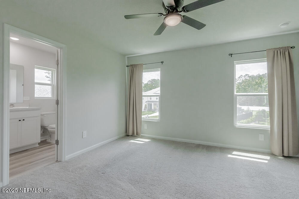 14438 Macadamia Lane Jacksonville, FL 32218 - Photo 4 of 32 a view of an empty room with a window