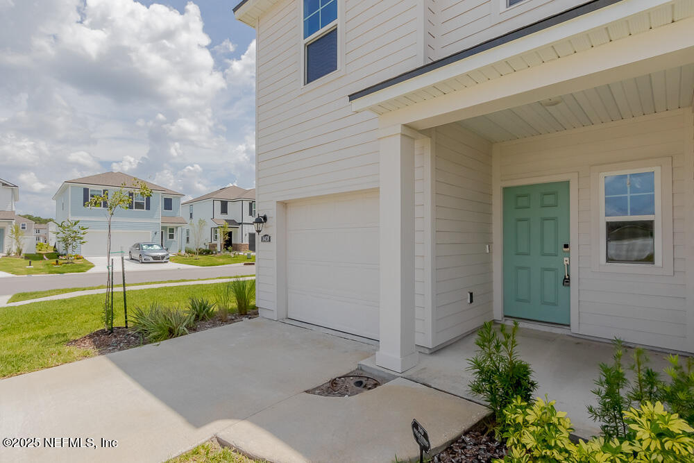 14438 Macadamia Lane Jacksonville, FL 32218 - Photo 6 of 32 a view of house with outdoor space and tub