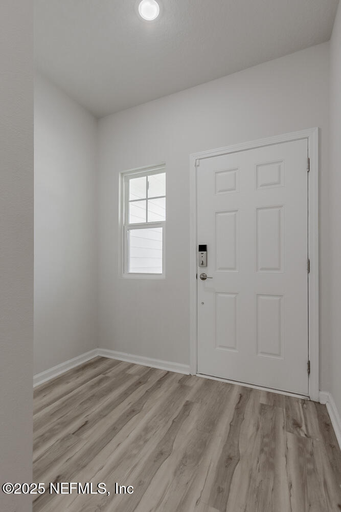 14438 Macadamia Lane Jacksonville, FL 32218 - Photo 7 of 32 wooden floor in an empty room