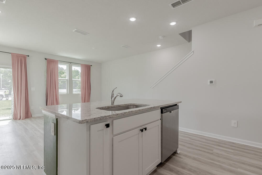 14438 Macadamia Lane Jacksonville, FL 32218 - Photo 10 of 32 a kitchen with sink and window