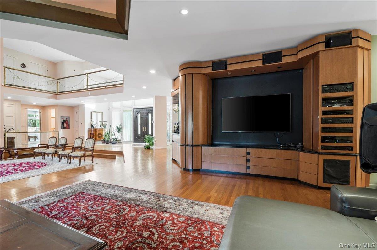 12 Ridge Court Glen Head, NY 11545 - Photo 7 of 46 Living room with light wood-style flooring and recessed lighting