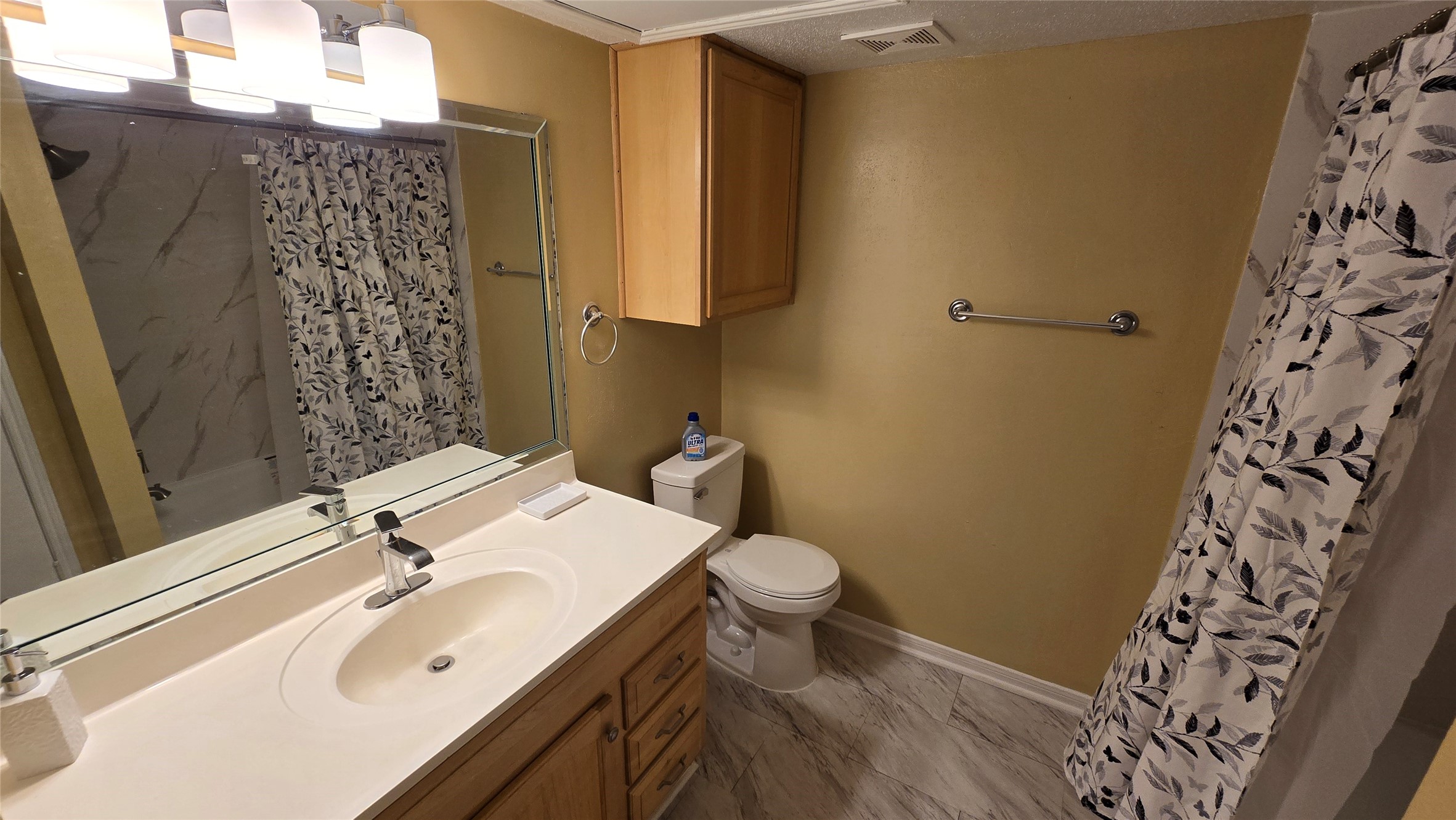 135 April Point Drive North Conroe, TX 77356 - Photo 12 of 28 a bathroom with a sink toilet and shower