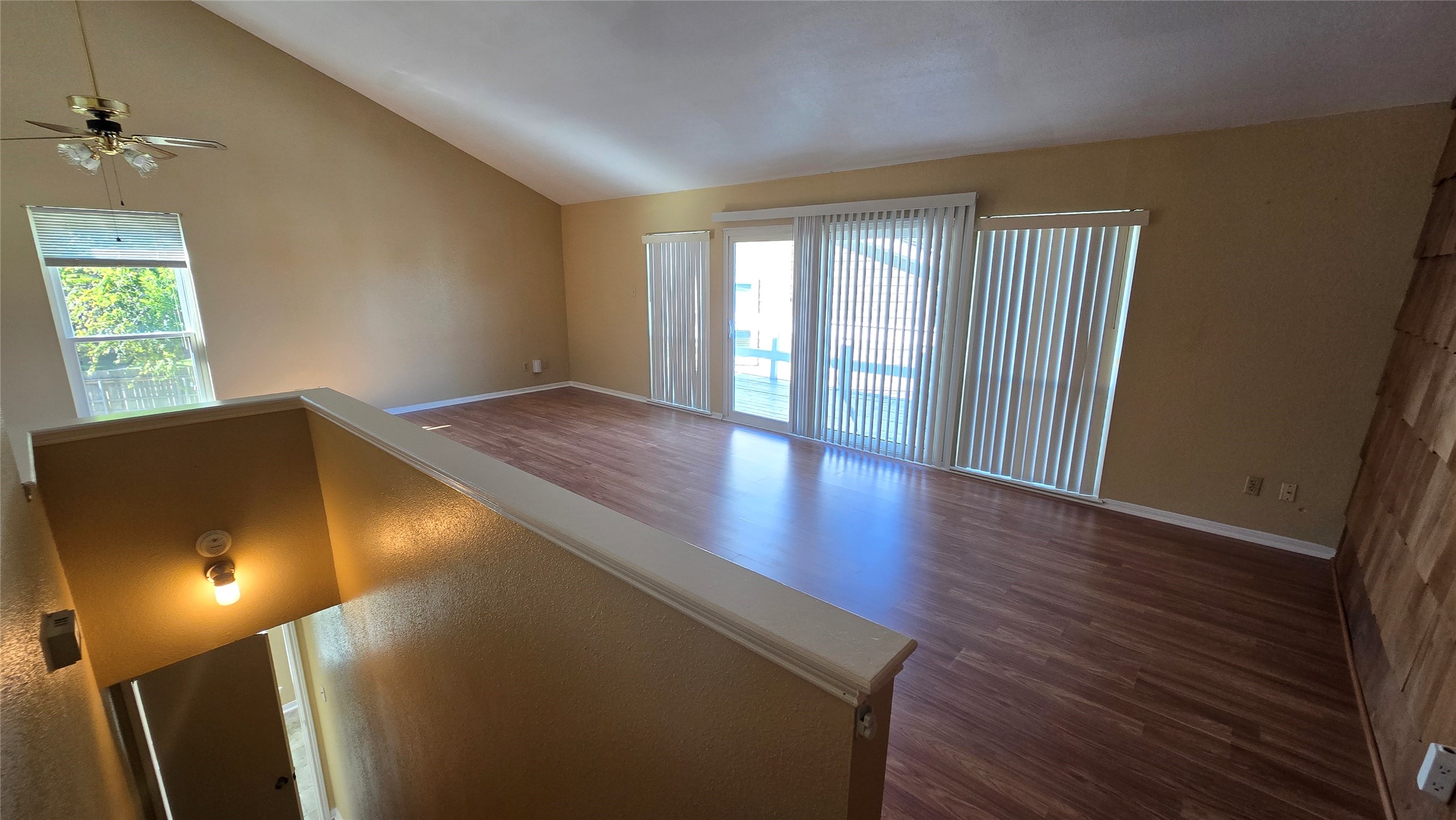 135 April Point Drive North Conroe, TX 77356 - Photo 16 of 28 wooden floor in an empty room with a window