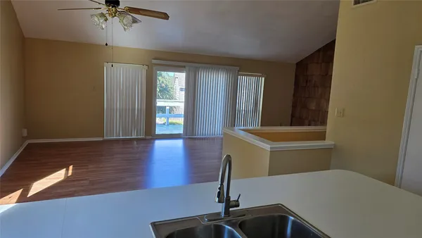 a kitchen with a sink and a microwave