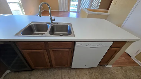 a kitchen with a refrigerator and a microwave