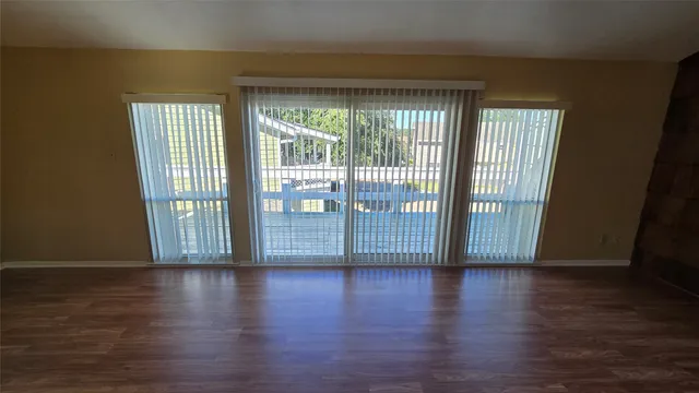 a view of a house with backyard and deck